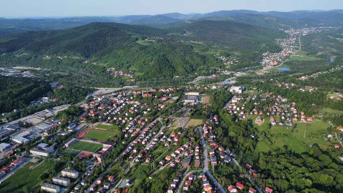 an aerial view of a small town surrounded by mountains